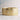 Gold ring with embedded diamonds on a light background