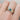 Gold ring with a emerald green gemstone and diamonds on a finger handmade by Kate Smith Birmingham