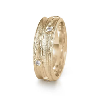 A yellow gold textured ring with scattered diamonds