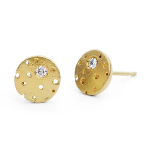 A pair of patterned 18ct gold earrings with a central brilliant cut diamond, surrounded by frosted gold details, with a stud fitting.