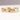A 9ct yellow gold eternity ring with patterned texture and pink brilliant cut diamonds set in it.
