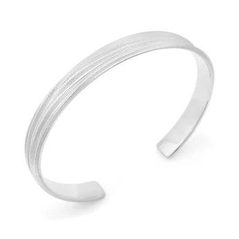 A silver cuff bracelet with a textured matte finish and a polished inside, designed to fit around the wrist.