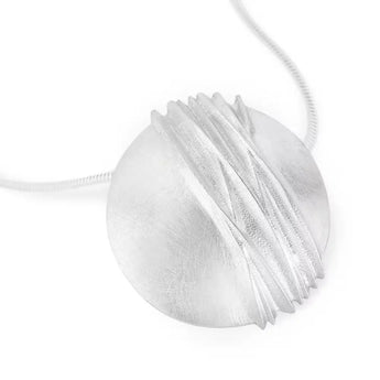 A silver necklace with a textured satin finish pod and a chain threaded through two discreet holes on the reverse, fastened by a contemporary T-bar style catch.