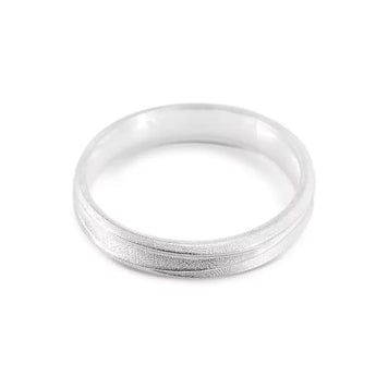 A slim silver ring with a textured exterior and a smooth interior, designed to resemble windswept sand dunes.