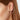 A pair of gold earrings featuring a spiral pattern with a satin finish, displayed against a white background.