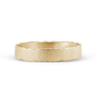 A 9ct yellow gold unisex wedding ring with a frosted finish and nibbled edges, displayed against a white background.