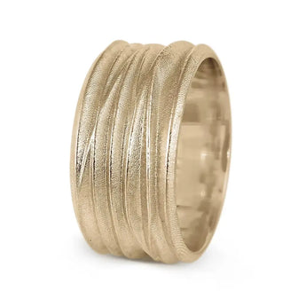 A wide, textured yellow gold wedding ring
