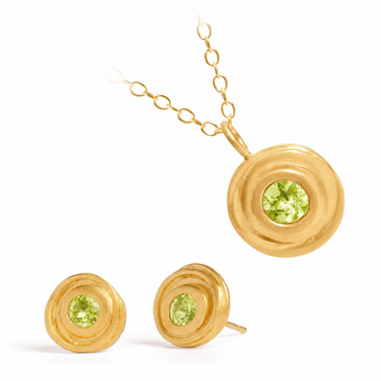 Gold jewelry set featuring a pendant necklace and matching stud earrings, each with a textured spiral gold setting and a round green peridot gemstone, shown on a white background.