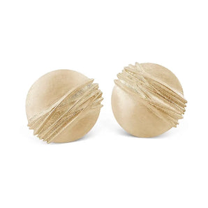 A pair of organic, contemporary round gold earrings with delicate raised patterning, inspired by windswept sand dunes.