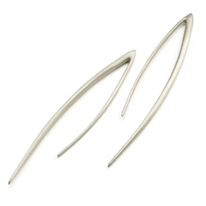 A pair of silver curved spike strand earrings with a satin finish, displayed against a white background.