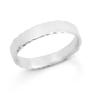 A silver wedding ring with nibbled edges and a frosted finish, displayed on a plain background.