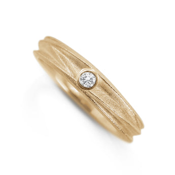 Textured 9ct yellow gold diamond ring with a gently rippled organic band and a single round diamond set into the surface